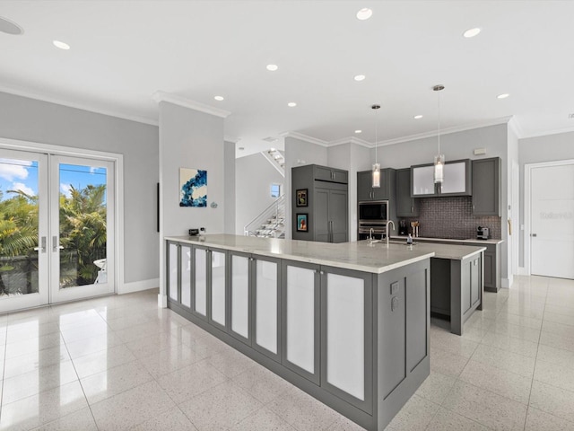 kitchen with recessed lighting, baseboards, a large island, fridge, and stainless steel microwave