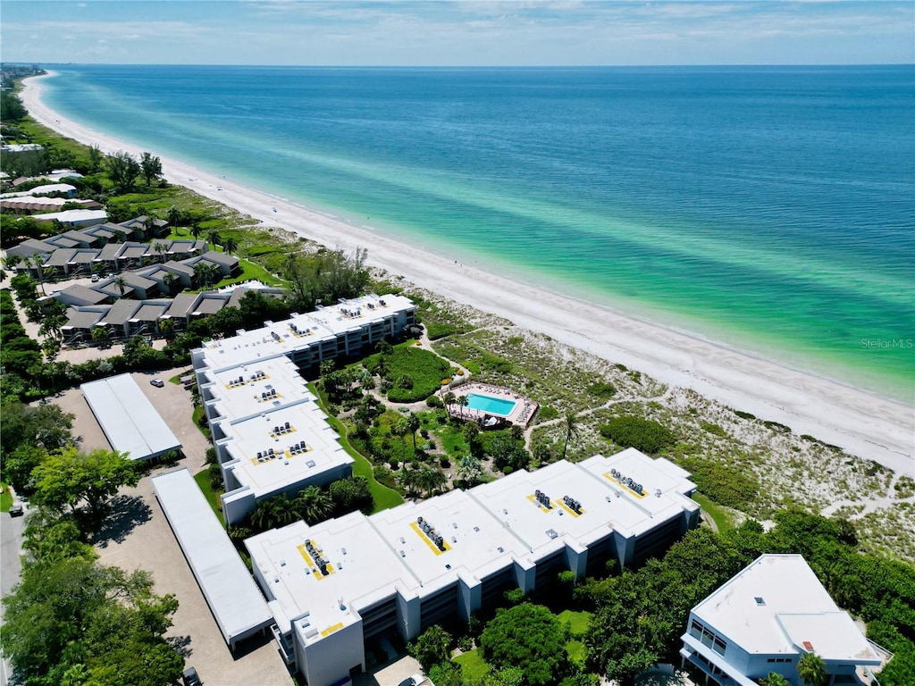 bird's eye view featuring a water view and a view of the beach