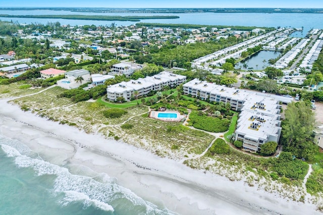 aerial view with a water view and a view of the beach