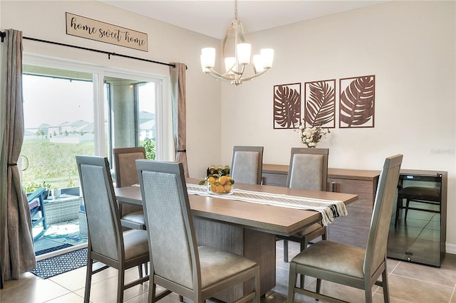 dining space with an inviting chandelier and light tile patterned flooring