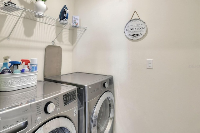 laundry area with washing machine and dryer