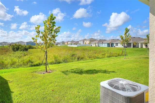 view of yard with central AC