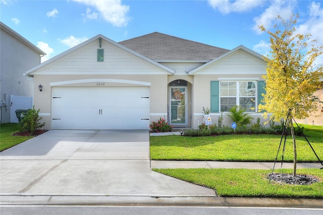 ranch-style home featuring a front yard and a garage