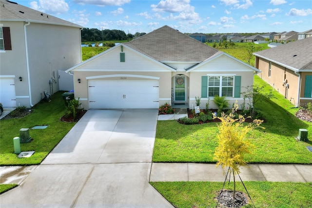 ranch-style home with a garage and a front yard