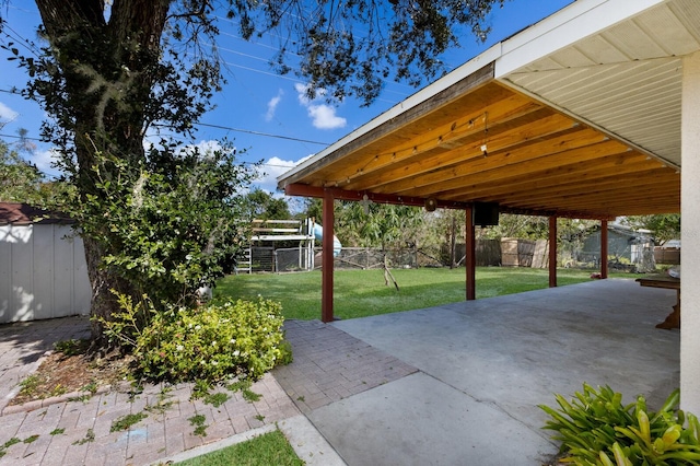 view of patio / terrace with a shed