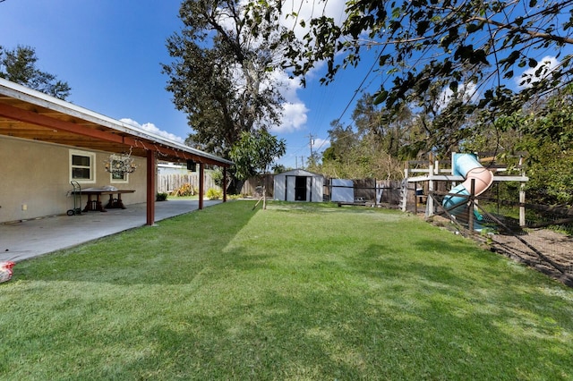 view of yard with a patio area and a shed