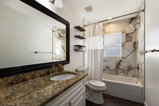 full bathroom featuring shower / bath combination with curtain, toilet, and vanity