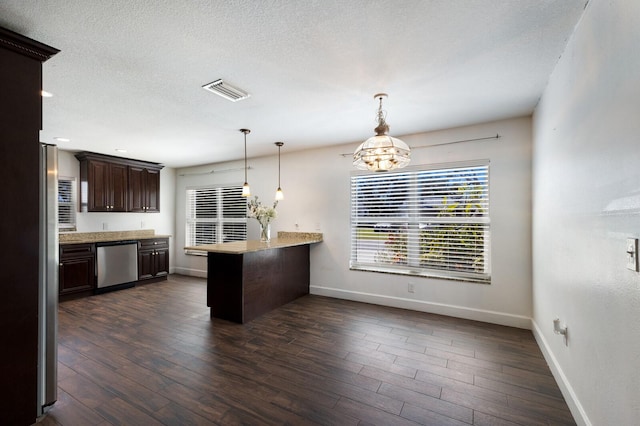 kitchen with a chandelier, dark brown cabinetry, dark hardwood / wood-style flooring, and stainless steel dishwasher