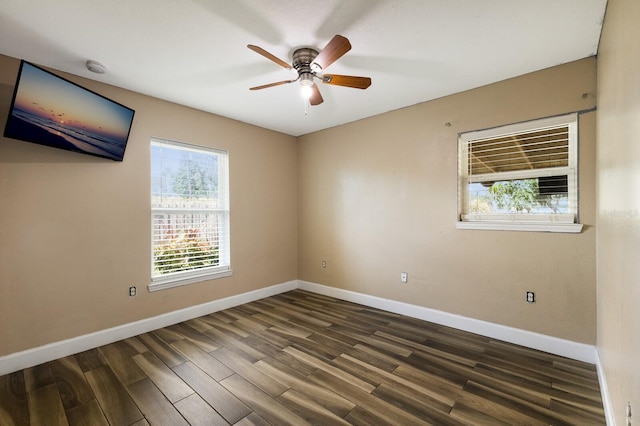 unfurnished room featuring dark wood-type flooring and ceiling fan