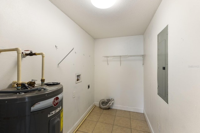 clothes washing area with electric water heater, hookup for a washing machine, hookup for an electric dryer, electric panel, and a textured ceiling