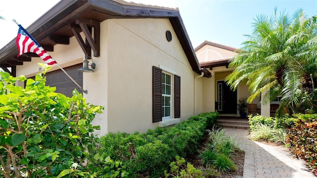 view of side of home with a garage