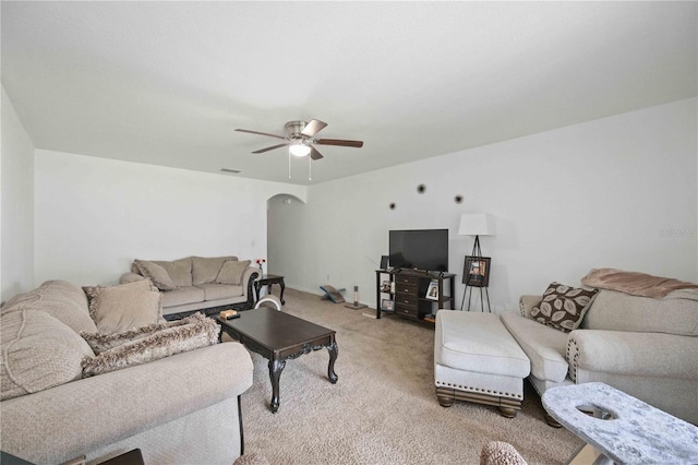 10959 Keys Gate Dr, Riverview, FL 33579 - living room featuring visible vents, arched walkways, light carpet, and ceiling fan