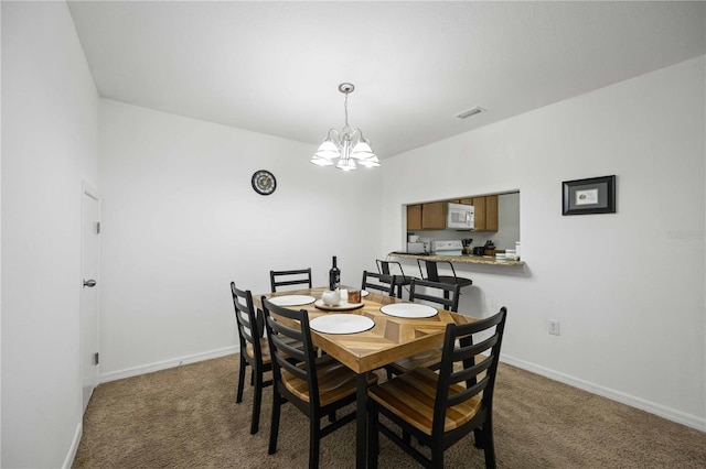 10959 Keys Gate Dr, Riverview, FL 33579 - carpeted dining space featuring a notable chandelier, baseboards, and visible vents
