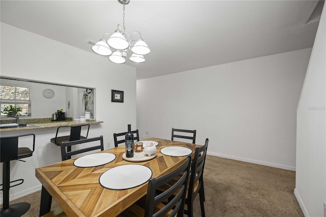 10959 Keys Gate Dr, Riverview, FL 33579 - carpeted dining space with baseboards, visible vents, and an inviting chandelier