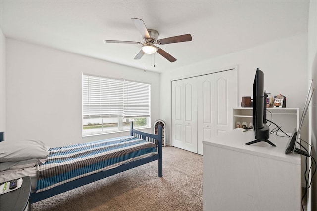 10959 Keys Gate Dr, Riverview, FL 33579 - bedroom featuring a closet, ceiling fan, and light colored carpet