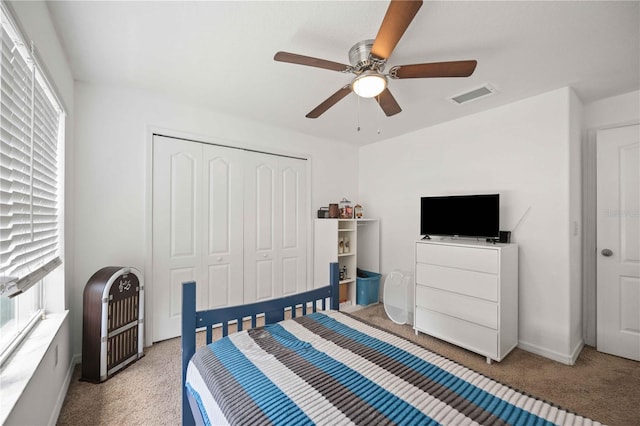 10959 Keys Gate Dr, Riverview, FL 33579 - bedroom featuring visible vents, light carpet, ceiling fan, and a closet
