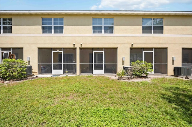 10959 Keys Gate Dr, Riverview, FL 33579 - back of property featuring central air condition unit, stucco siding, a yard, and a sunroom