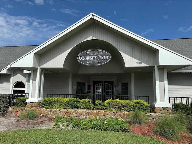 10959 Keys Gate Dr, Riverview, FL 33579 - entrance to property with a porch and a shingled roof
