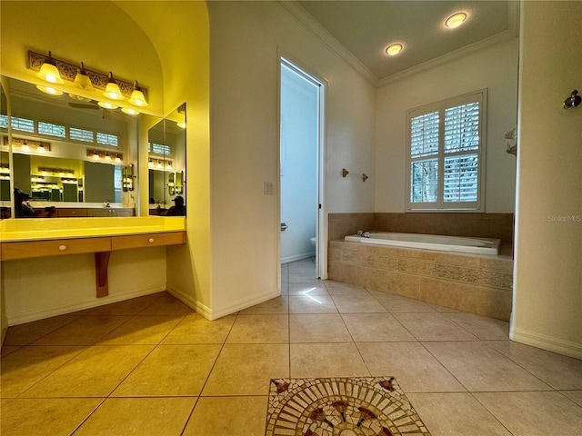 bathroom featuring ornamental molding, tile patterned floors, vanity, a relaxing tiled tub, and toilet