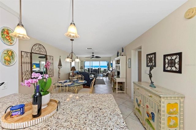 dining space featuring a ceiling fan, light tile patterned flooring, and visible vents