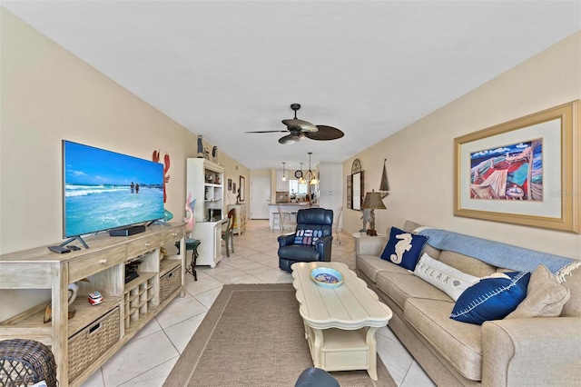 living room featuring light tile patterned floors and a ceiling fan