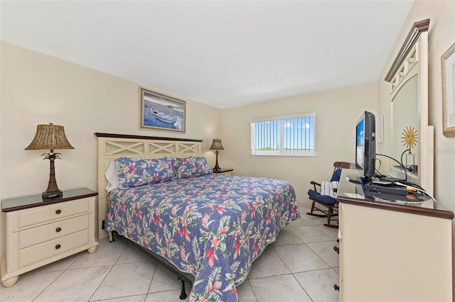 bedroom with light tile patterned floors