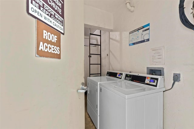 shared laundry area with washing machine and clothes dryer