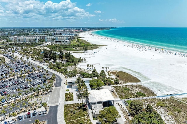 aerial view featuring a view of the beach and a water view