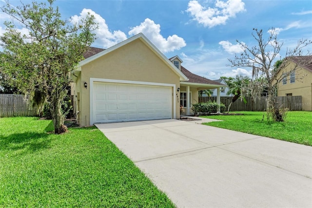 view of front of property with a front yard and a garage