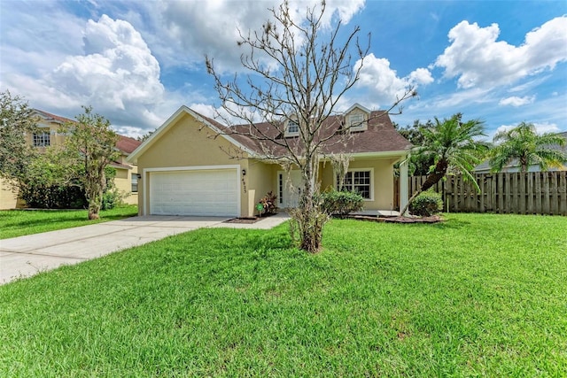 view of front of house featuring a front lawn and a garage