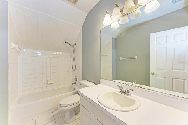 full bathroom with vanity, toilet, tile patterned floors, and tiled shower / bath