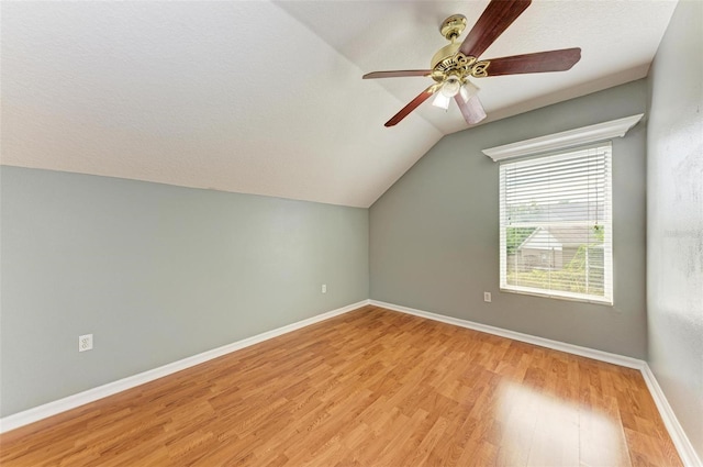 bonus room with lofted ceiling, ceiling fan, a textured ceiling, and light hardwood / wood-style floors