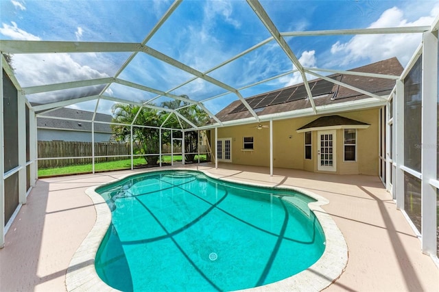 view of swimming pool with a lanai and a patio