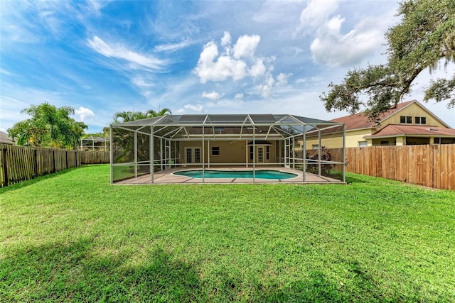 exterior space with a patio area, a fenced in pool, and a lanai