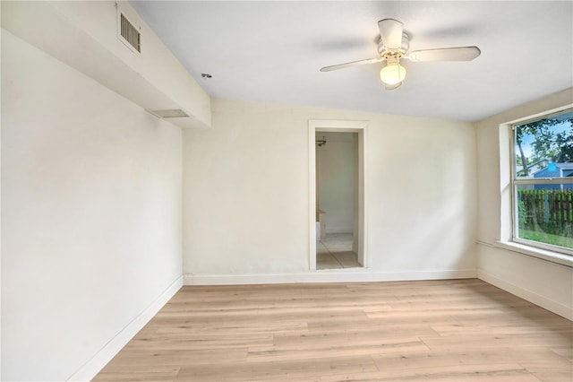 empty room featuring light wood-type flooring and ceiling fan