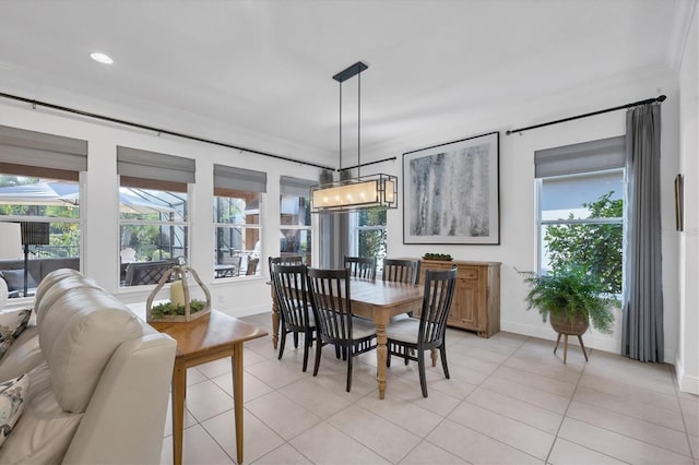 tiled dining room with crown molding