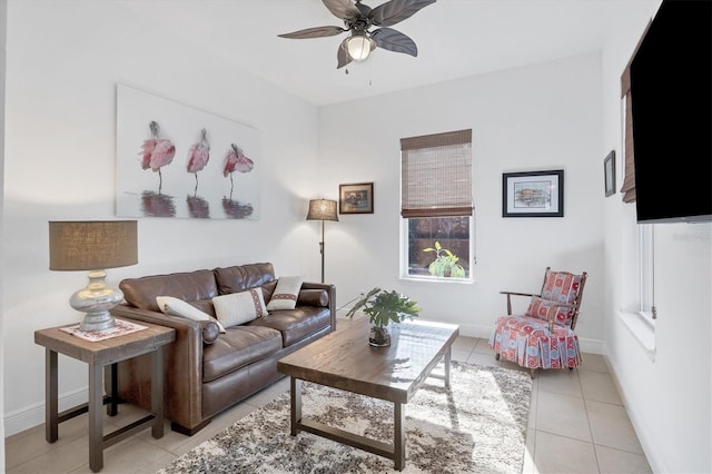 tiled living room with ceiling fan