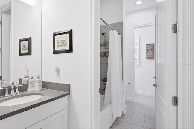 bathroom featuring shower / tub combo with curtain, tile patterned floors, and vanity