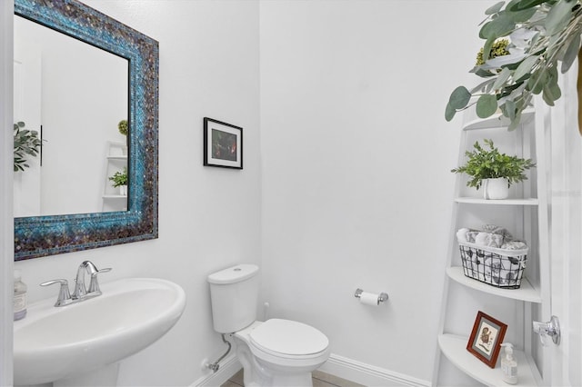 bathroom with sink and toilet