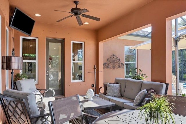 view of patio featuring an outdoor living space and ceiling fan