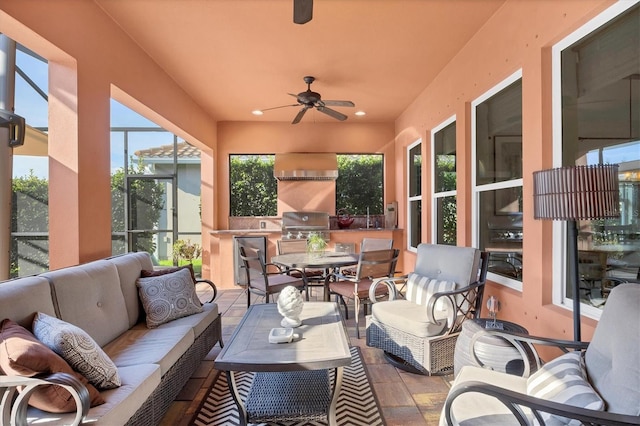 sunroom / solarium with ceiling fan