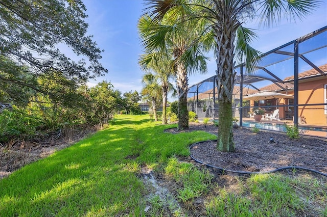 view of yard featuring a lanai