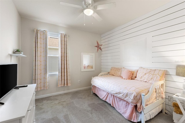 bedroom featuring light colored carpet and ceiling fan