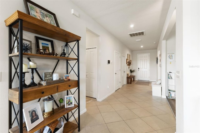 corridor with light tile patterned floors