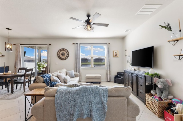 living room with light tile patterned floors and ceiling fan