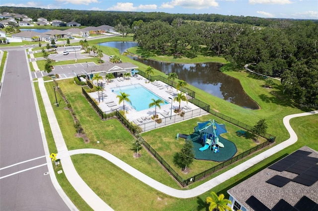 birds eye view of property with a water view