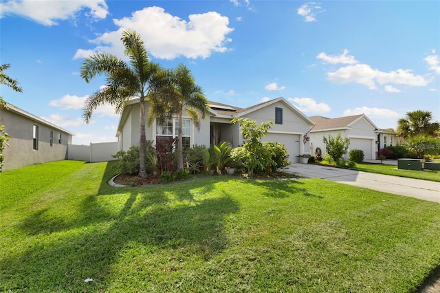 view of front of property featuring a garage and a front lawn