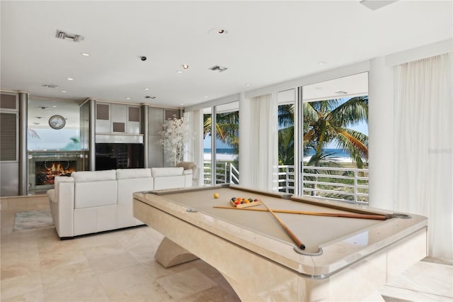 game room featuring a lit fireplace, pool table, visible vents, and recessed lighting