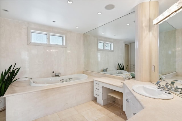 bathroom featuring a garden tub, recessed lighting, tile walls, vanity, and tile patterned floors