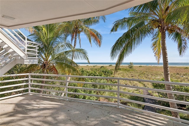 balcony featuring a water view